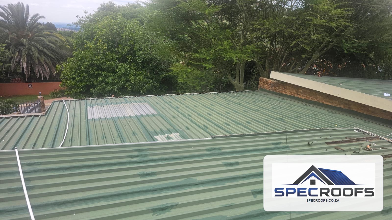 Metal roof inspected before Specroofs maintenance work